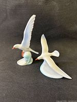 Both Hollohaza porcelain seagull figurines front angle