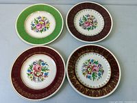 Top view of four assorted border floral plates