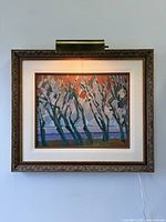 Framed painting front view under picture light