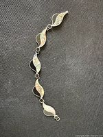 Front view of bracelet showing five inlaid sterling links