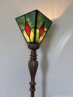 Close-up of stained glass shade showing colours and pattern