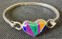 Front view of sterling bangle showing heart inlay detail