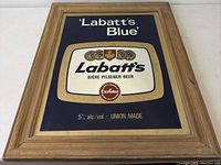 Front view of sign lying flat, full graphics visible