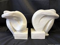 Front view of both bookends showing abstract nude forms