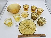 All nine amber glass pieces arranged
