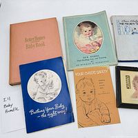 Group shot of all baby books, pamphlets and framed photo