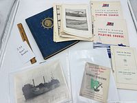 Group shot of all publications, photo and prints spread on table