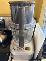 Assembled food processor showing base, bowl and lid