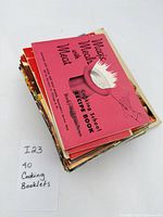 Stack of approximately forty vintage recipe pamphlets