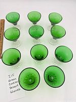 Full set of 11 green cocktail/dessert glasses displayed top and side views