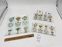 All three trays, sugar bowl and creamer displayed together