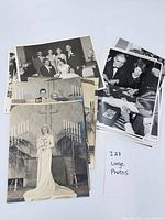 Overall lot showing two stacks of photographs