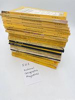 Stack of 27 yellow-spine National Geographic magazines