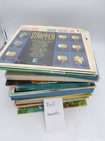 Stack of vinyl records showing top cover David Rose More Music of the Stripper