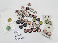 Group view of assorted soda bottle caps laid out on surface