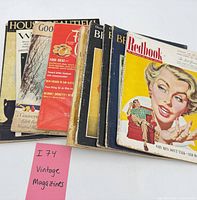 Group shot of all 10 magazines stacked, visible titles Redbook, House Beautiful