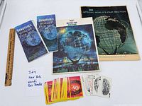 All items laid out: three maps, insert pack, magazine, playing cards, ruler