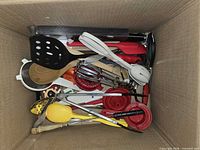 Top view of box showing mixed utensils tightly packed