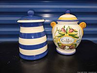 Front view of both ceramic jars showing designs and lids