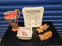 All five items: pitcher, frame, bowl with candles, two wooden trucks