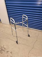 Walker standing open showing wheels and frame