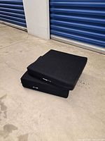 Side view of cushions stacked, highlighting thickness and fabric cover