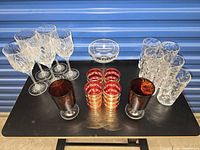 Group shot of all 19 glassware pieces arranged on a table