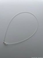 Full view of cable chain necklace in teardrop layout showing overall length and shape