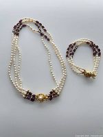 Full view of necklace and bracelet showing overall design and materials