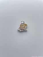 Front view of enameled SpongeBob charm showing colors and loop