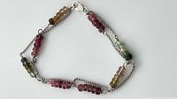 Full view of double-strand silver bracelet with tourmaline beads