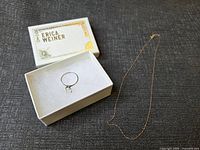 Ring in Erica Weiner box beside 10K gold chain