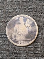 Obverse view showing Seated Liberty design and 1875 date