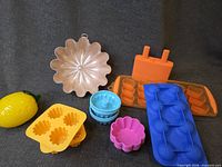 Group view of all molds including copper, silicone trays, tart cups, popsicle mold