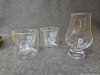Front view of snifter and two skull shot glasses