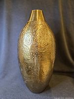 Full view of vase showing overall shape and engraved design