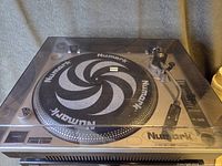 Full view of Numark TT-1510 turntable with dust cover closed