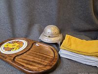 All items grouped: wooden board, caviar server, napkins