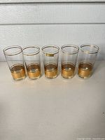 Five Culver highball glasses lined up front view