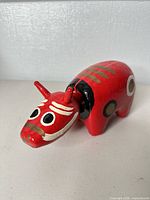 Front angled view showing face, horns and painted eyes