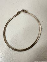 Full view of sterling silver herringbone bracelet