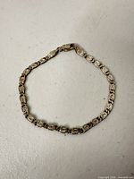Full view of sterling silver patterned link bracelet