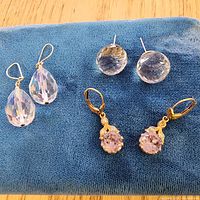 All three earring pairs on blue background