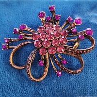 Front view showing purple rhinestones and metal finish