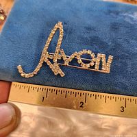 Front view showing full brooch on ruler for scale