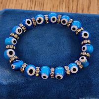 Full view of bracelet laid flat showing bead pattern and spacers