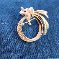 Front view showing bow design and rhinestones