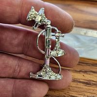 front view of silver-tone rhinestone brooch