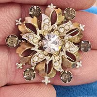 Front view showing overall snowflake design and stones