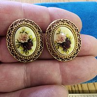 Front view of both earrings showing floral cabochons and gold-tone filigree frames